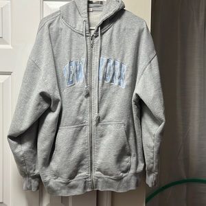 Brandy Melville Iohn Galt New York Grey Hoodie Baby blue letters